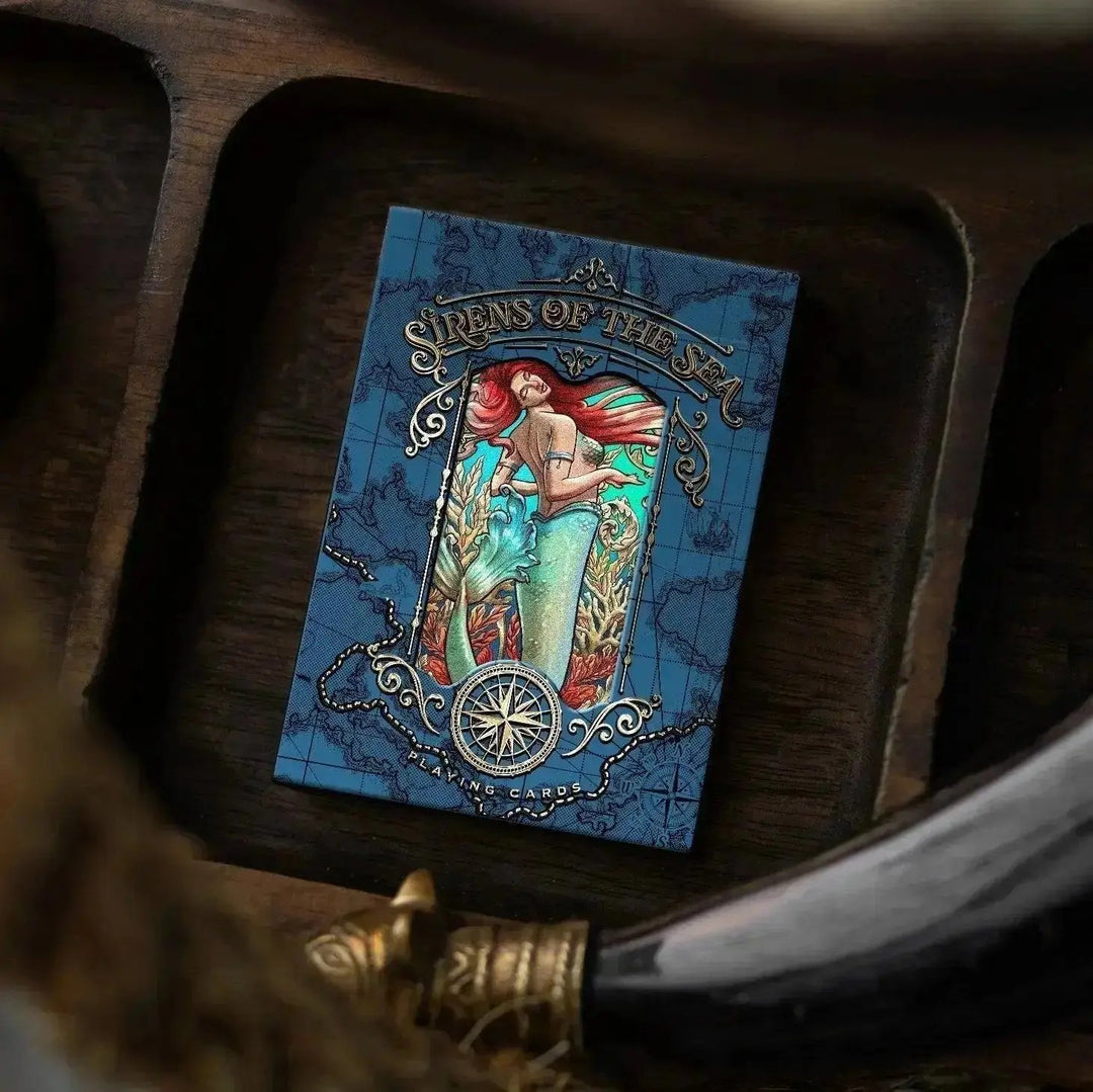 Sirens of the Sea playing cards with vibrant artwork featuring a mermaid on a blue background