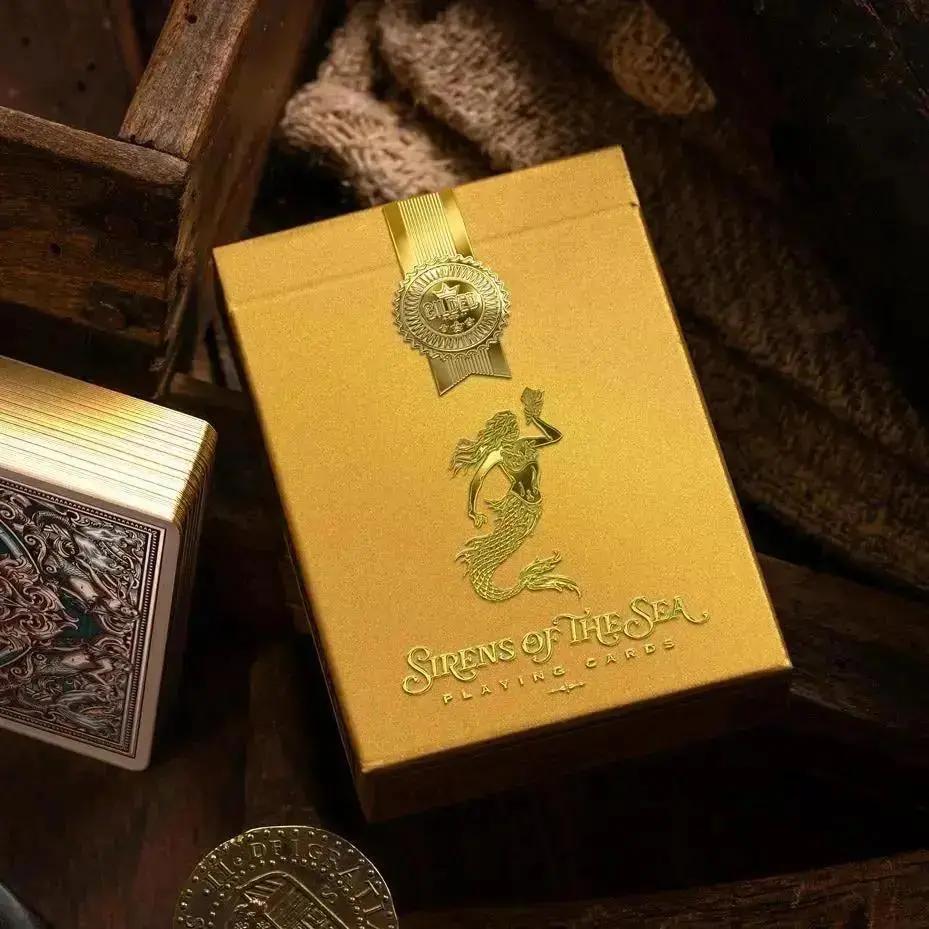 Sirens Dabloons Edition playing cards featuring gold foil accents and ornate packaging