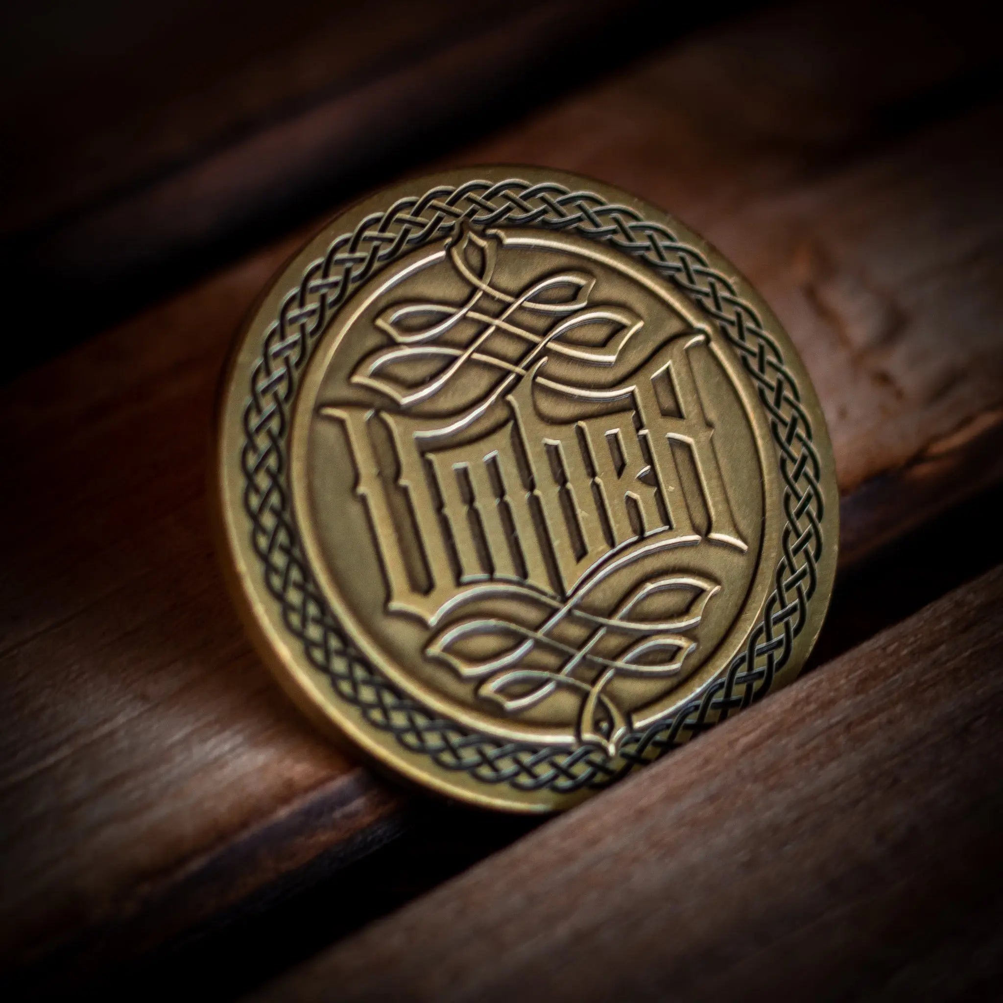 Unique playing card accessories including a beautifully crafted poker chip with intricate designs