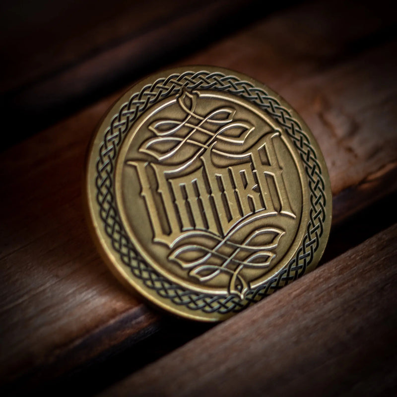 Unique playing card accessories including a beautifully crafted poker chip with intricate designs