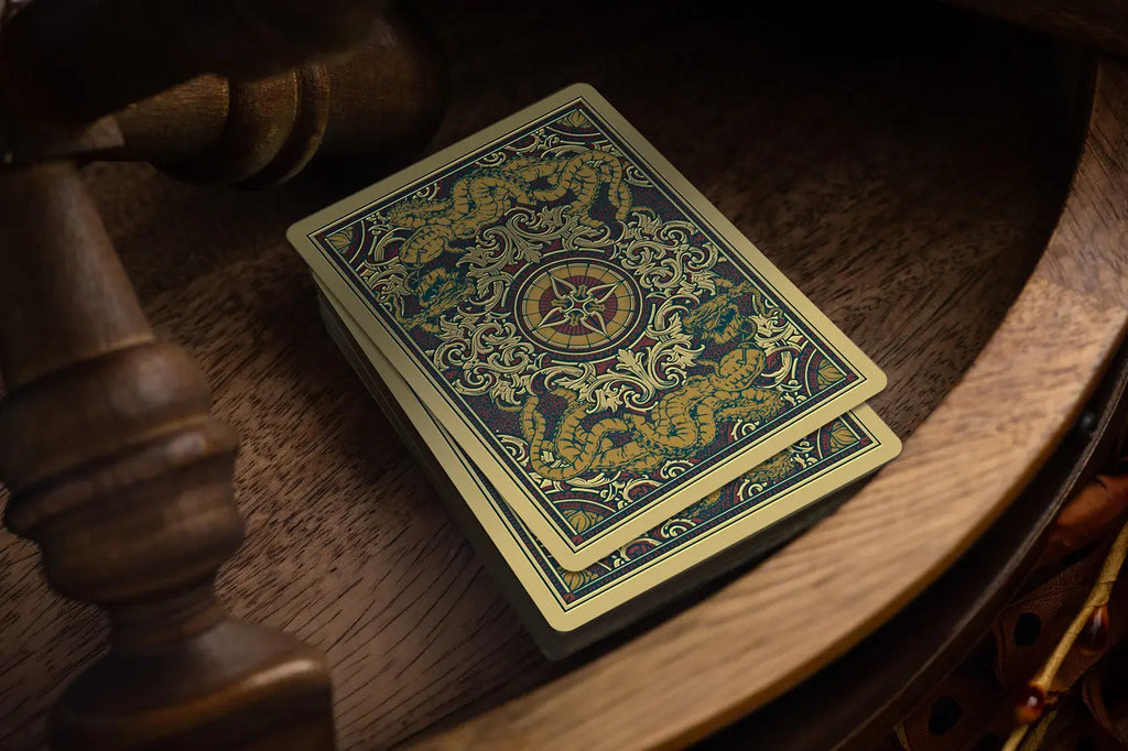 Blood and Brine playing card backs featuring gold foil details