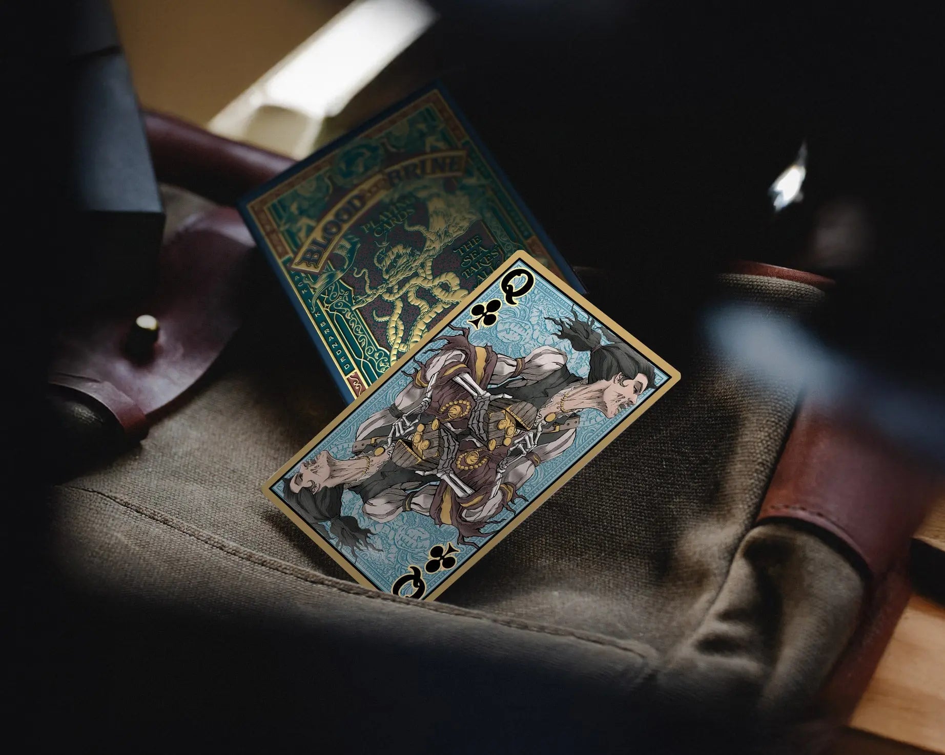 Blood and Brine Queen of Clubs beside the Classic Edition tuck