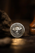 Blood and Brine dealer coin pirate skull side