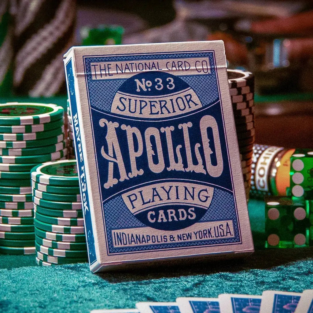Apollo Blue playing cards in a stylish box surrounded by colorful poker chips