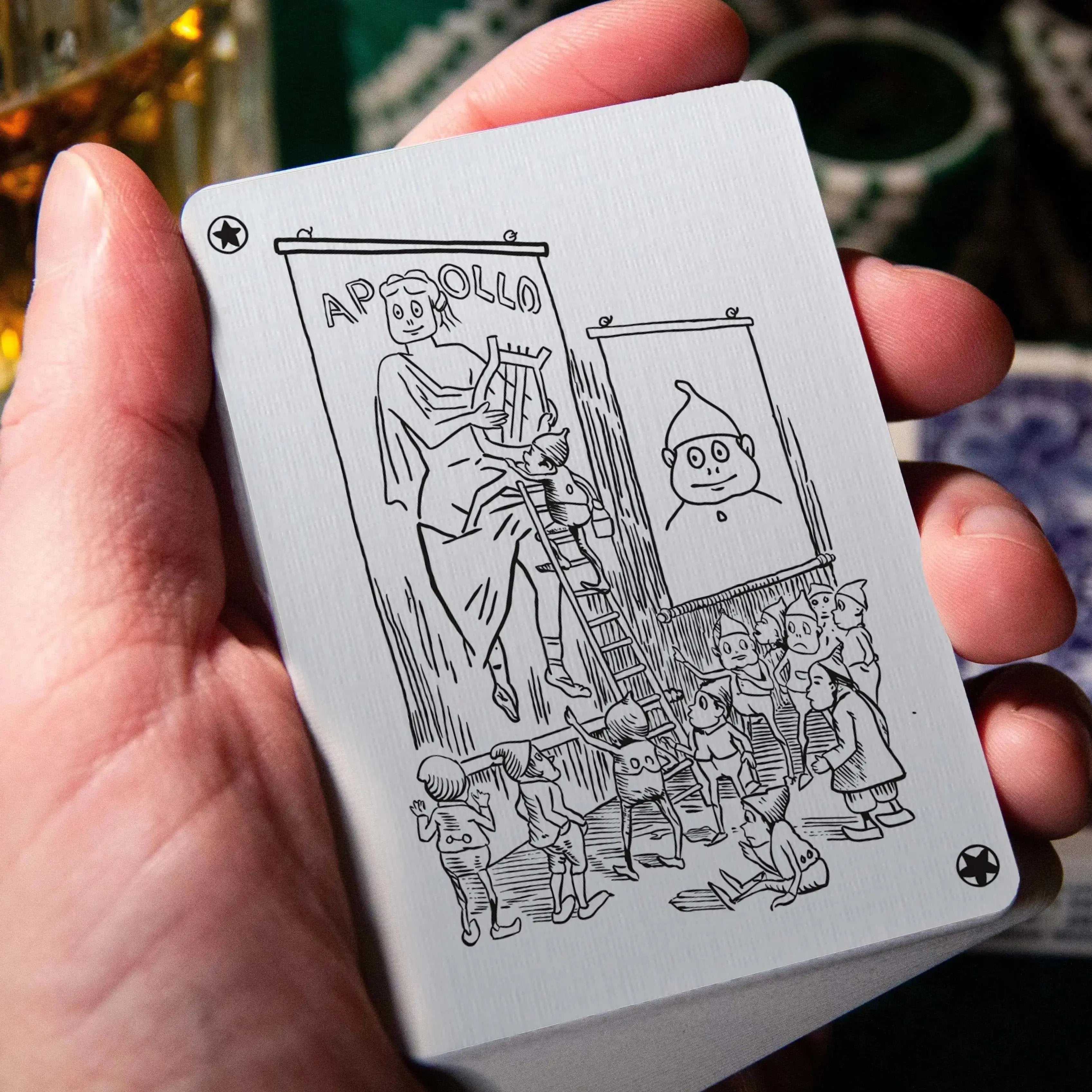 Apollo Blue playing cards featuring unique illustrated designs on the card backs