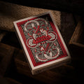 Forged Playing Cards Midgard's Revenge featuring intricate red and black designs with detailed artwork