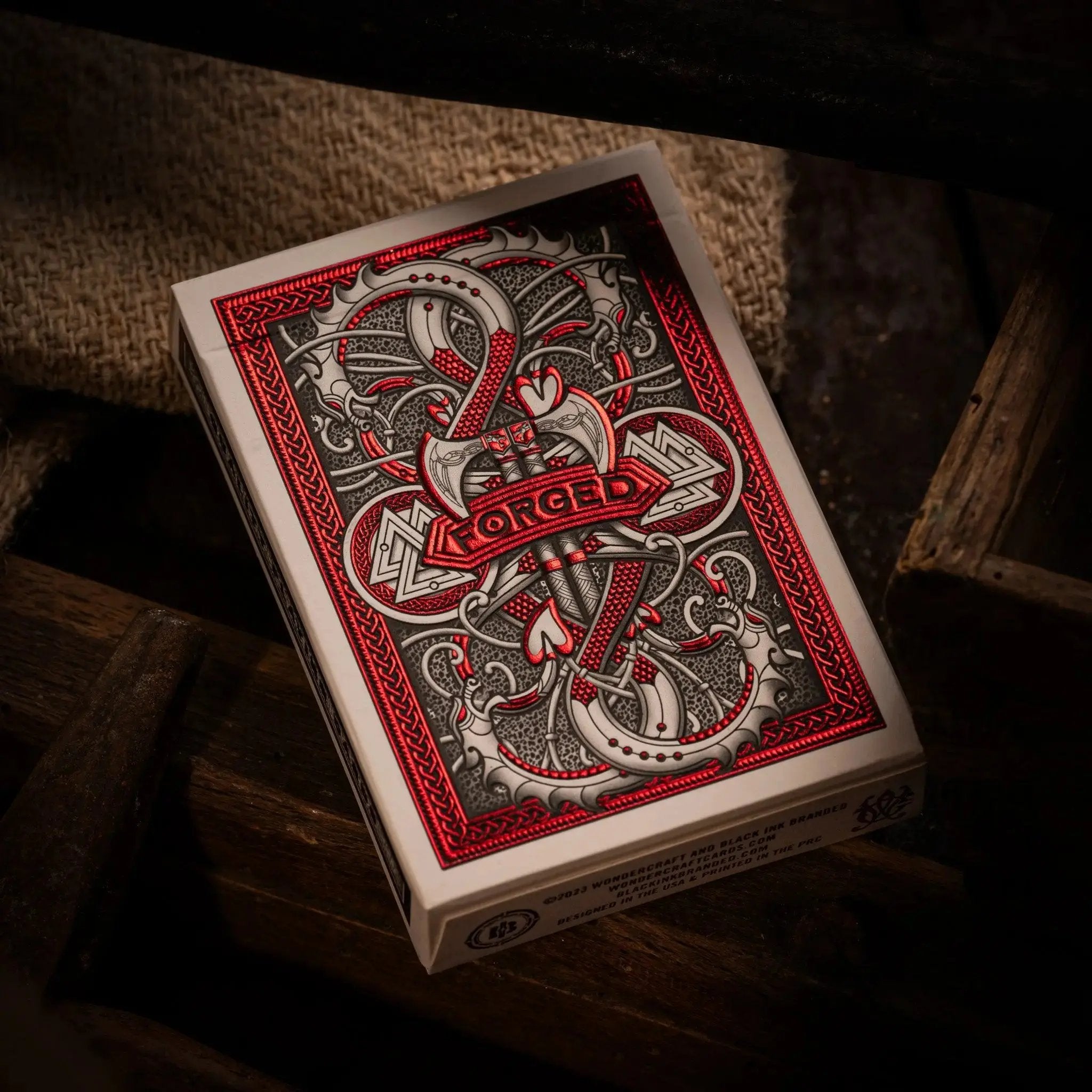 Forged Playing Cards Midgard's Revenge featuring intricate red and black designs with detailed artwork