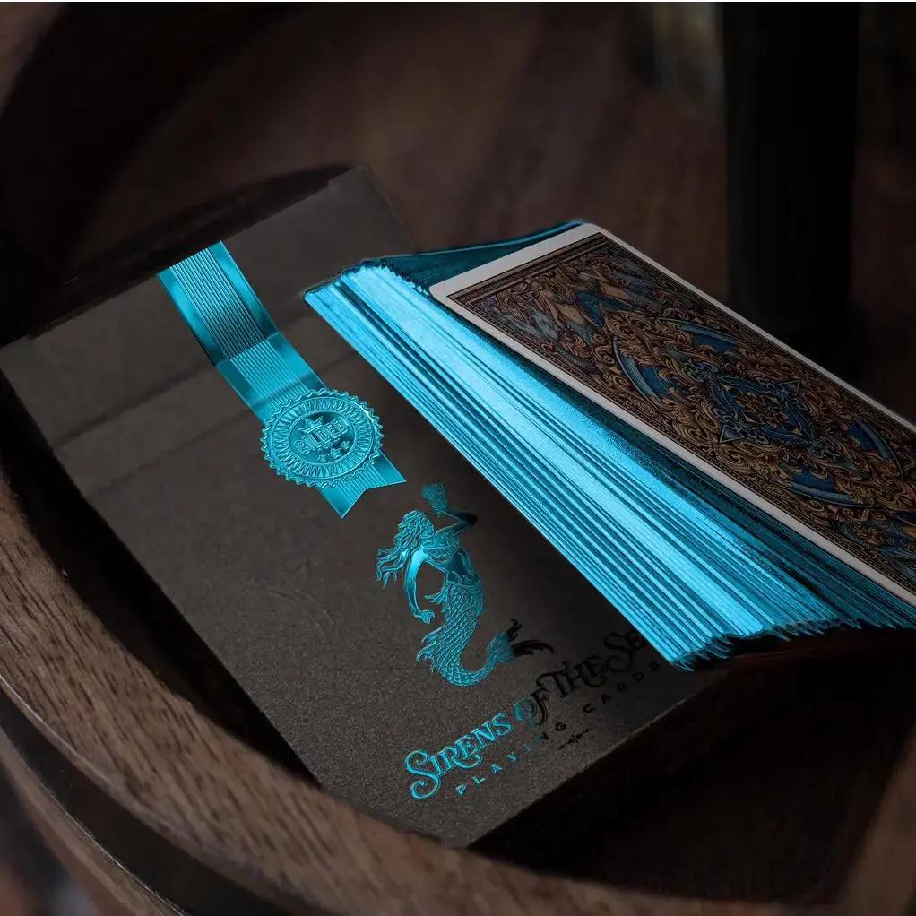 Sirens Nymphs playing cards in a decorative box with vibrant blue edges and a mermaid design