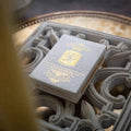 Sovereign luxury playing cards in elegant gray packaging with intricate design details