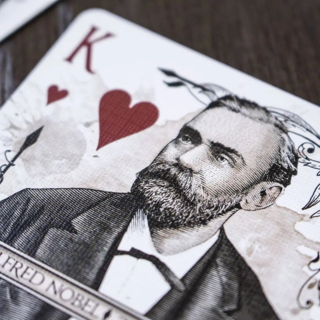 Close-up of devastation silver edition playing cards featuring a King design with a historical portrait