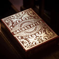 Golden Spike 150th Anniversary playing cards featuring ornate gold foil design on a red box