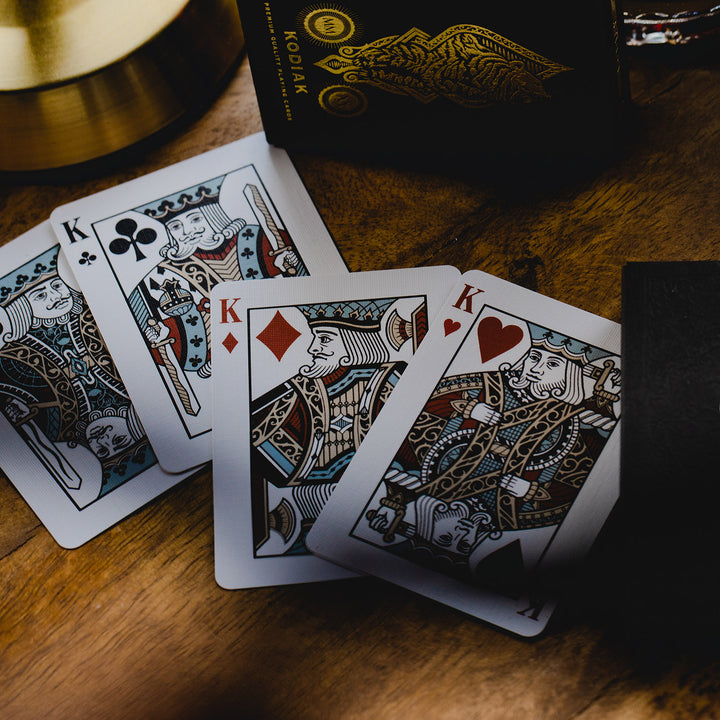 Kodiak 2020 edition playing cards featuring intricately designed face cards on a wooden table