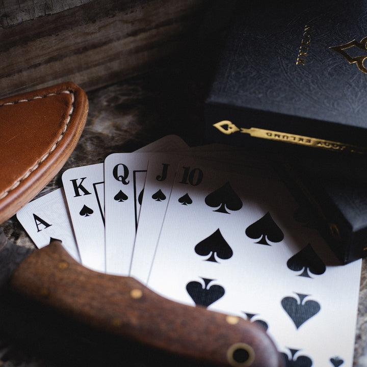 Kodiak 2020 edition playing cards displayed with Ace of Spades and leather card holder