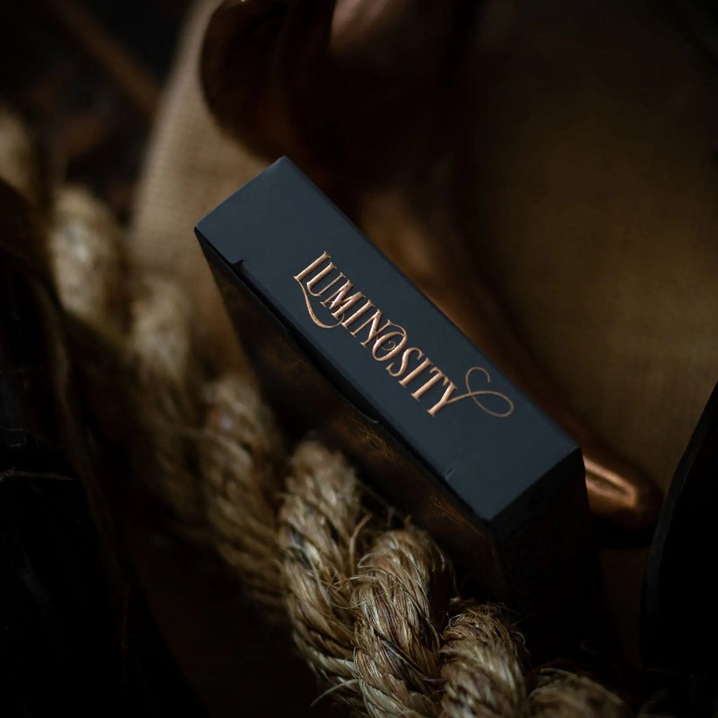 Close-up of Luminosity playing cards box featuring elegant design and premium finish
