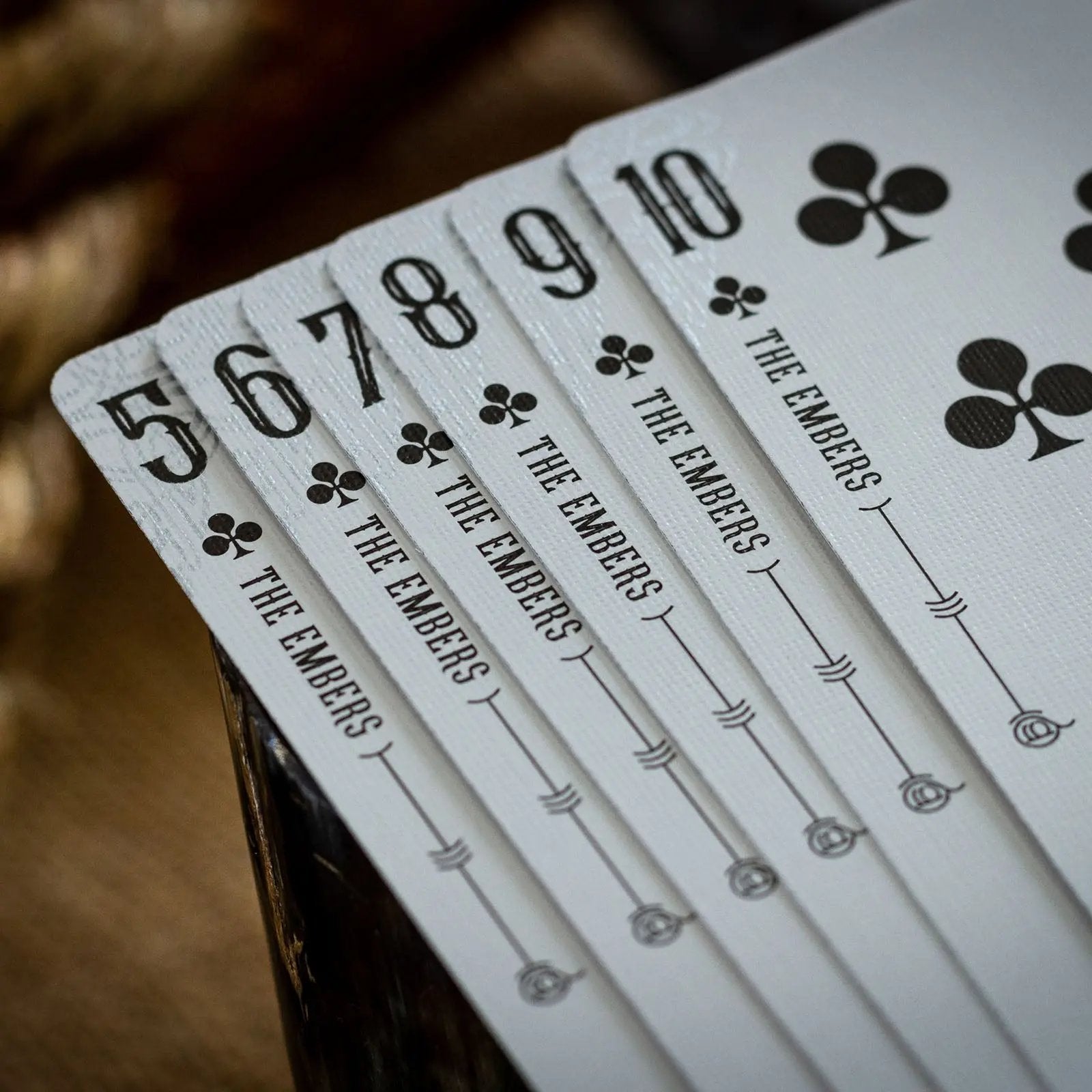 Luminosity playing cards featuring the Embers design with elegant numbers and symbols