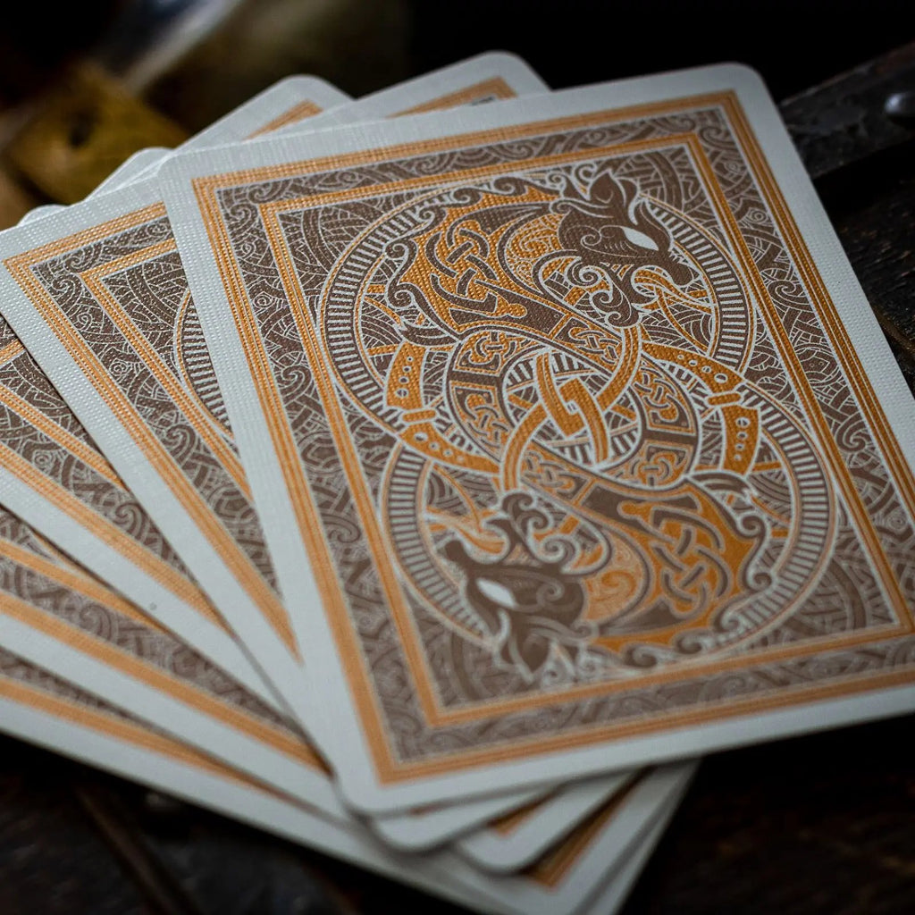 Luminosity playing cards with intricate design in gold and brown, perfect for card games and collectors