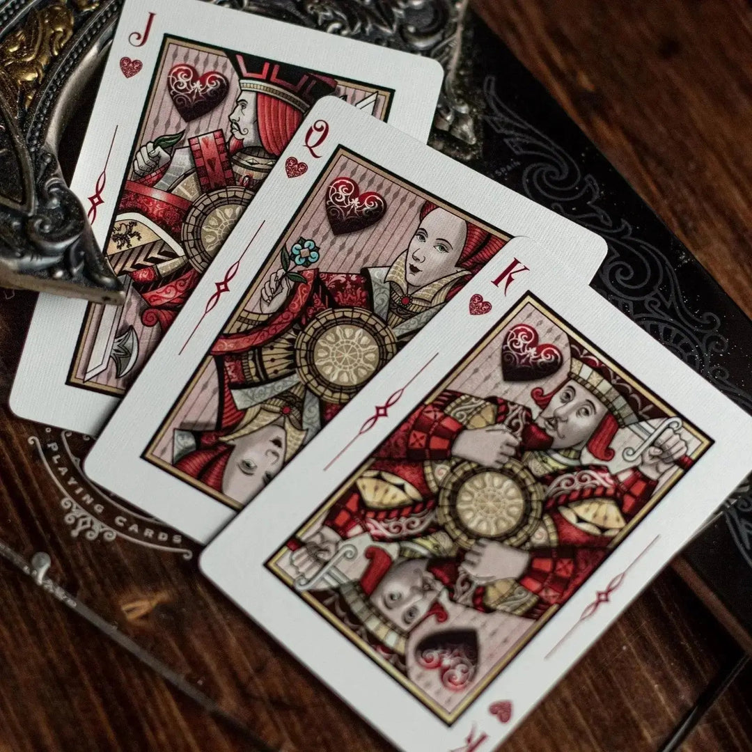 Sovereign luxury playing cards with intricate designs featuring the Jack, Queen, and King of Hearts