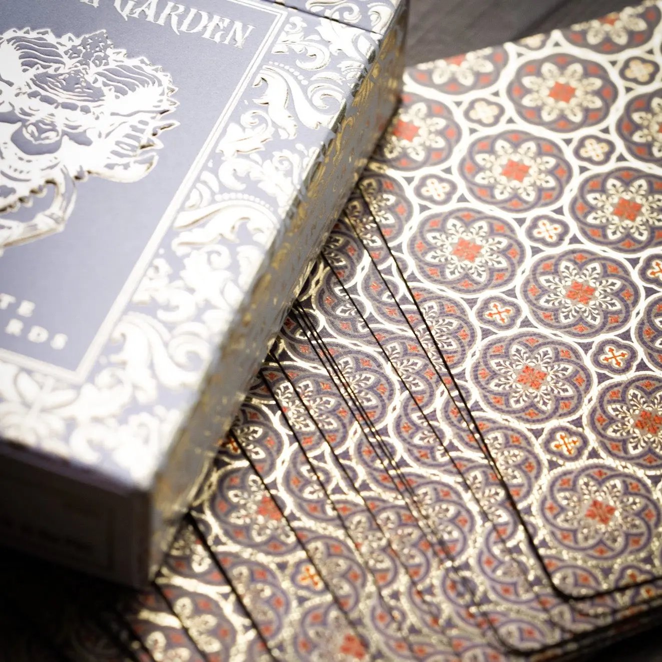 Stone Garden Second Edition playing cards with ornate design and gold foil accents in a stylish box