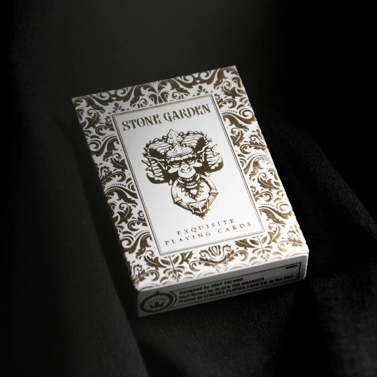 Stone Garden Second Edition playing cards in ornate white packaging with intricate design