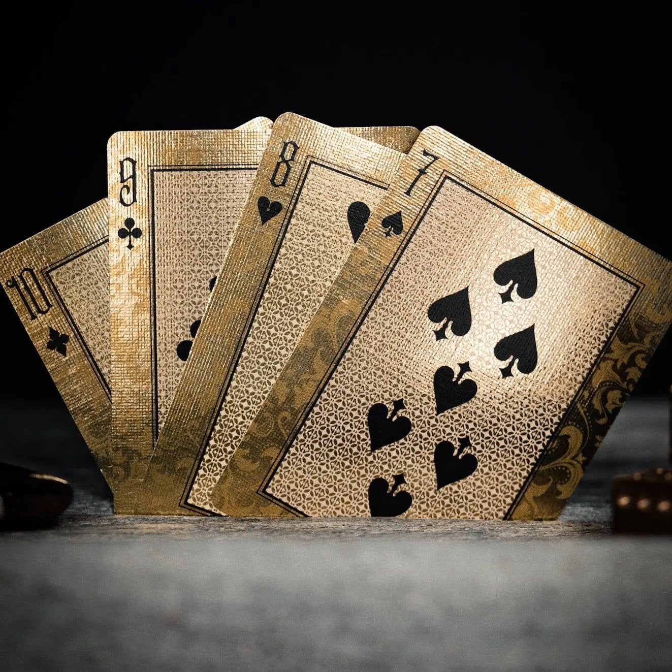 Stone Garden Second Edition playing cards displayed showing elegant design with gold and black elements